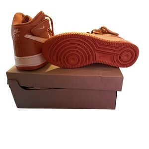 Nike Orange High-Top Sneakers with Vibrant Sole